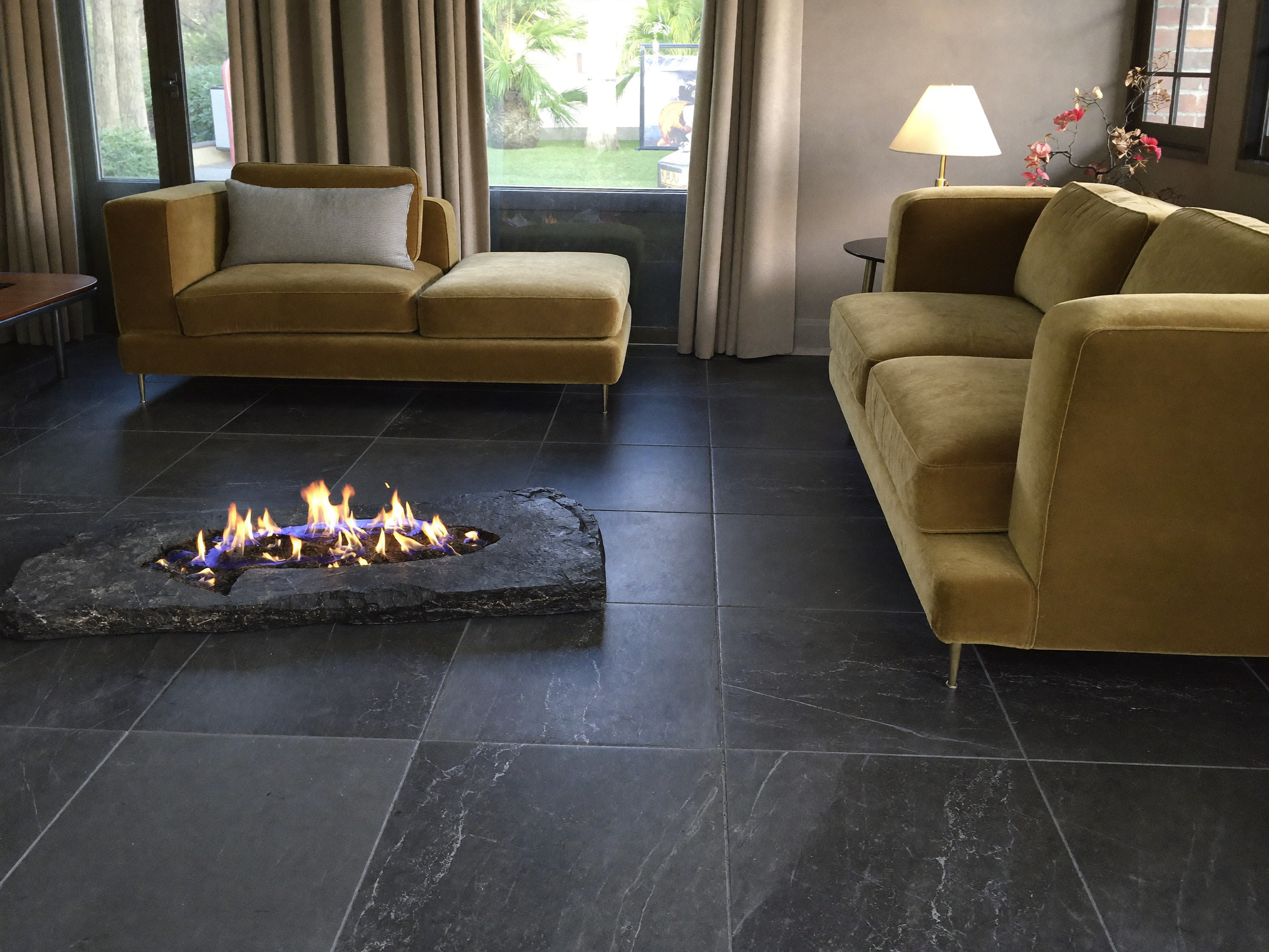 Round DIY fire pit built from stacked concrete pavers, showing the finished ring wall the calculator estimates materials for