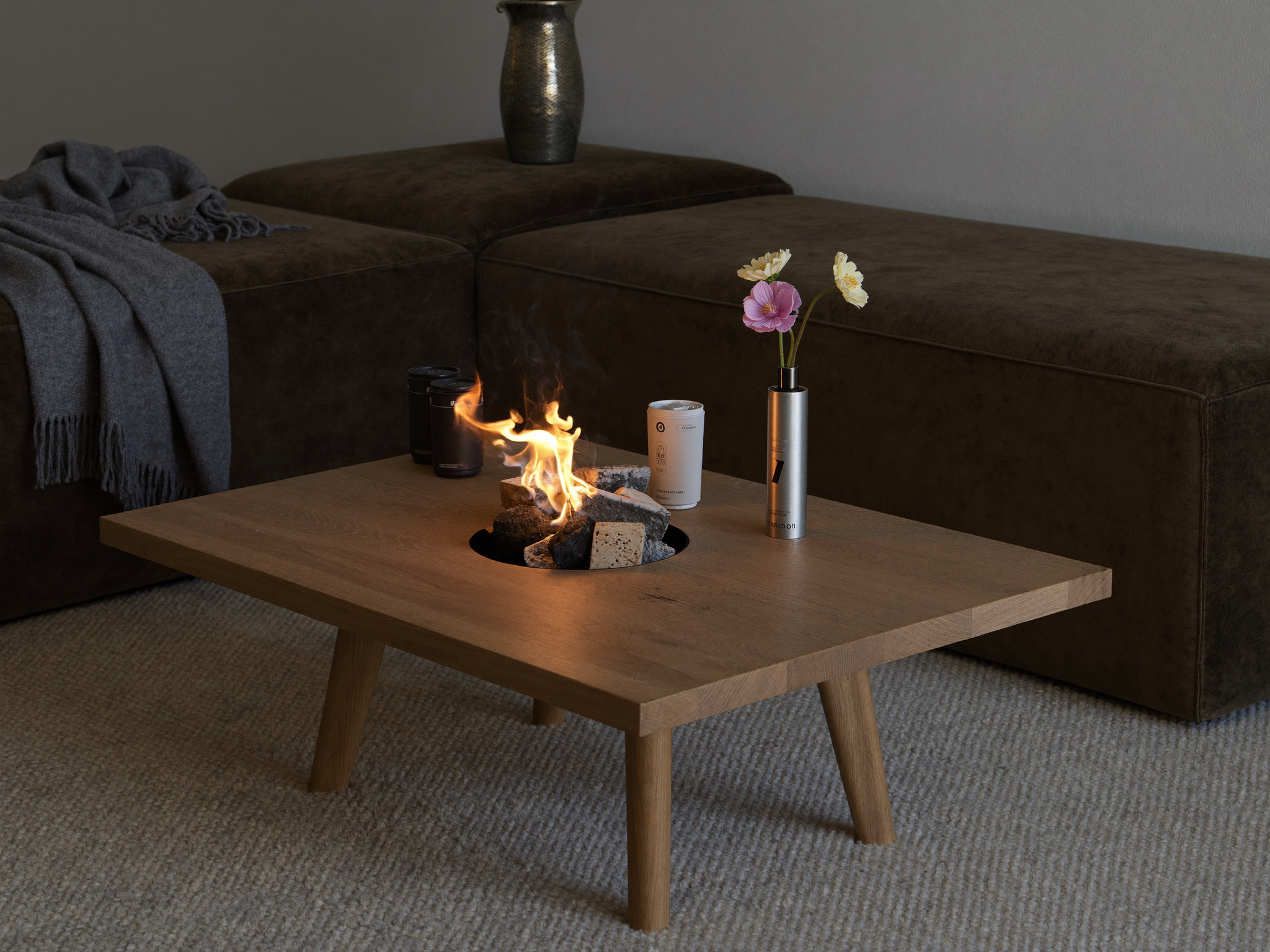 An electric fire pit set up on an outdoor patio near a GFCI protected outlet, positioned away from direct rain exposure.