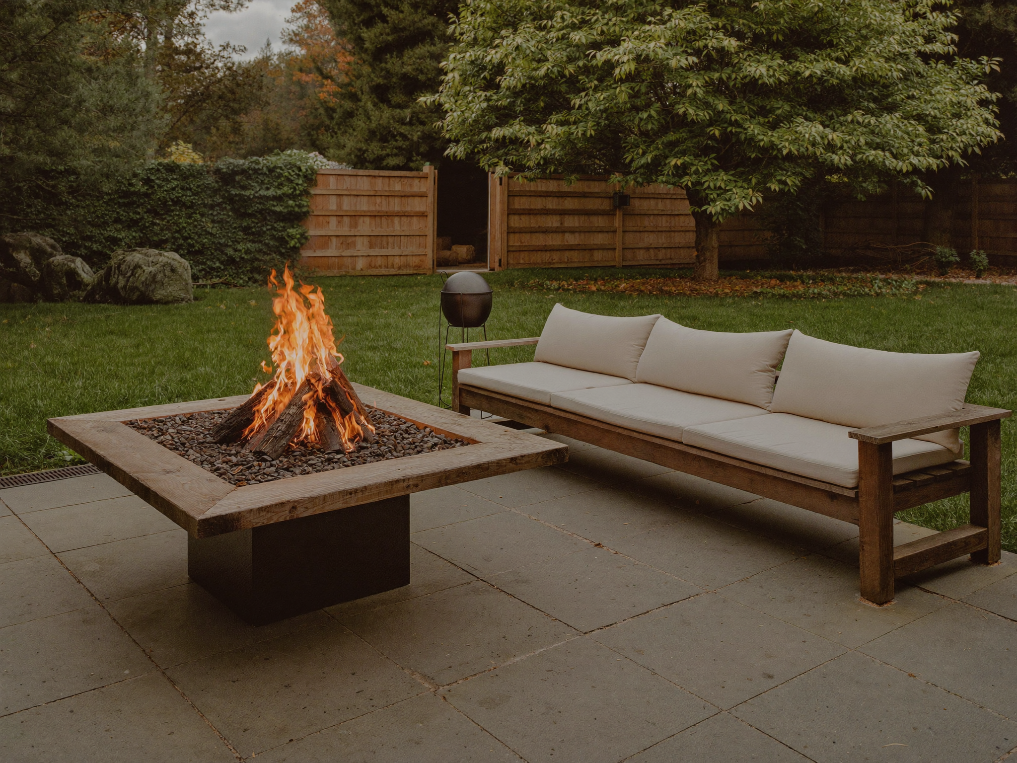 A fire burning cleanly in a fire pit after being lit using the top down method