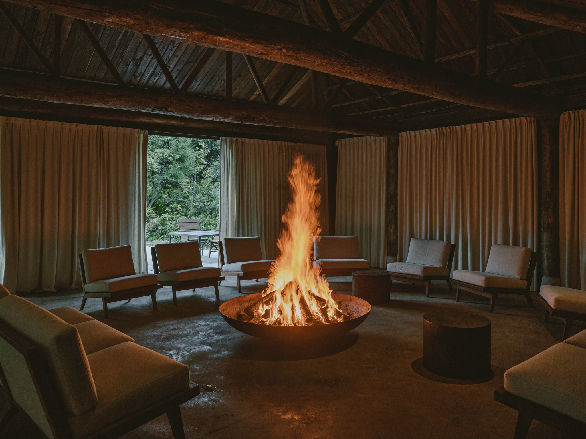 An indoor fire pit placed on a stable non combustible surface away from curtains and furniture, showing correct indoor placement.