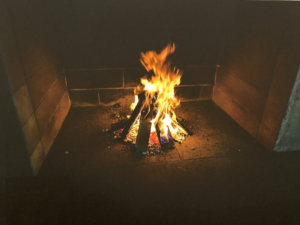 A dramatic wood-burning fire pit for the main image